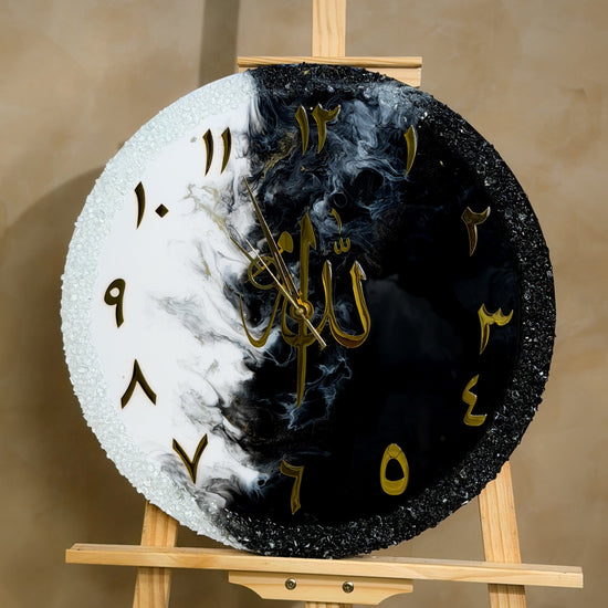 Handcrafted 20-inch resin wall clock in a black, white, and gold theme with White, Jet Black, and Gold Afloat pigments and a glossy epoxy resin finish.
