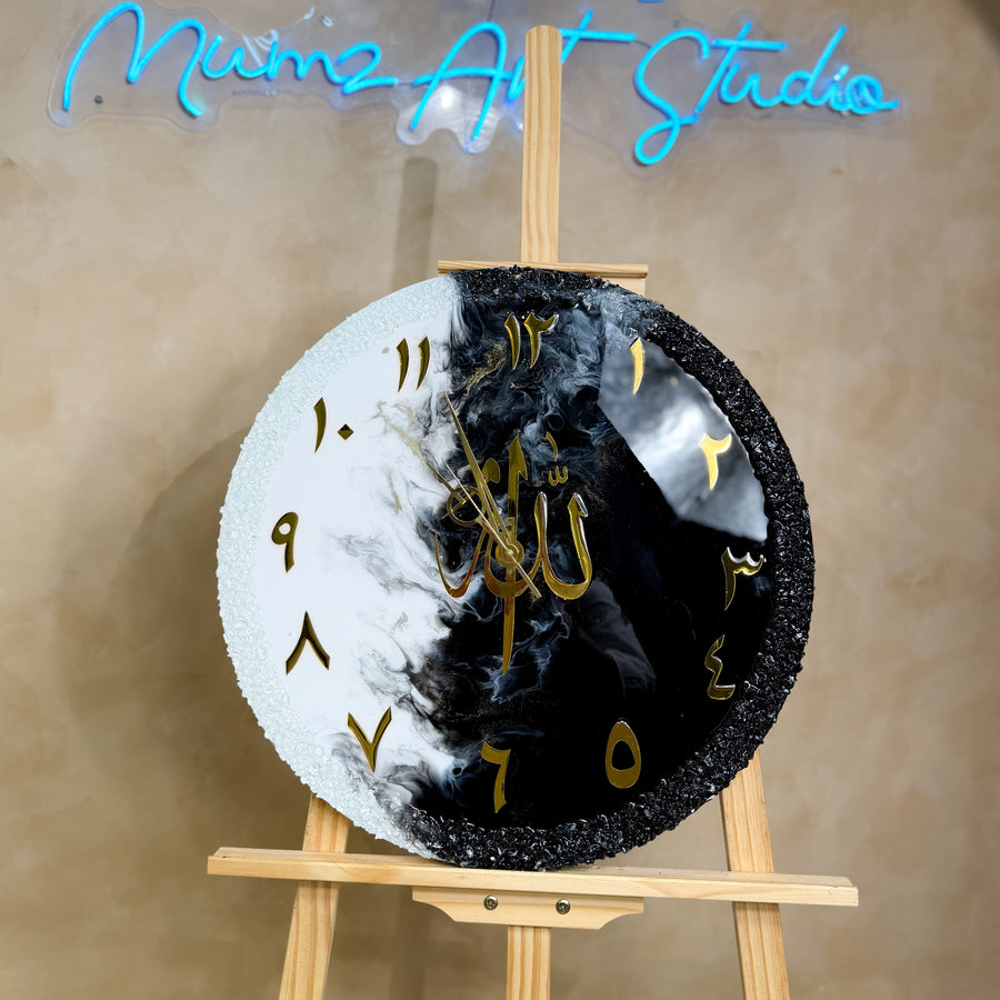 Handcrafted 20-inch resin wall clock in a black, white, and gold theme with White, Jet Black, and Gold Afloat pigments and a glossy epoxy resin finish.
